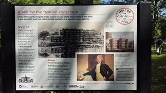 The information board describing the mill before it was burnt down