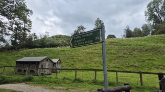 Signpost pointing back the way we have just come